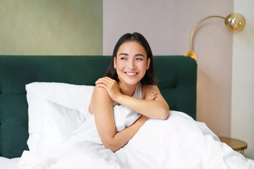 woman in bed smiling